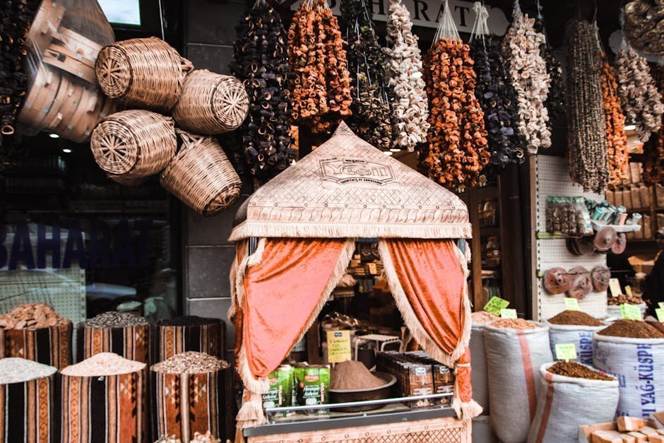 Colorful market stall showcasing hanging herbs and spices in a traditional setting.